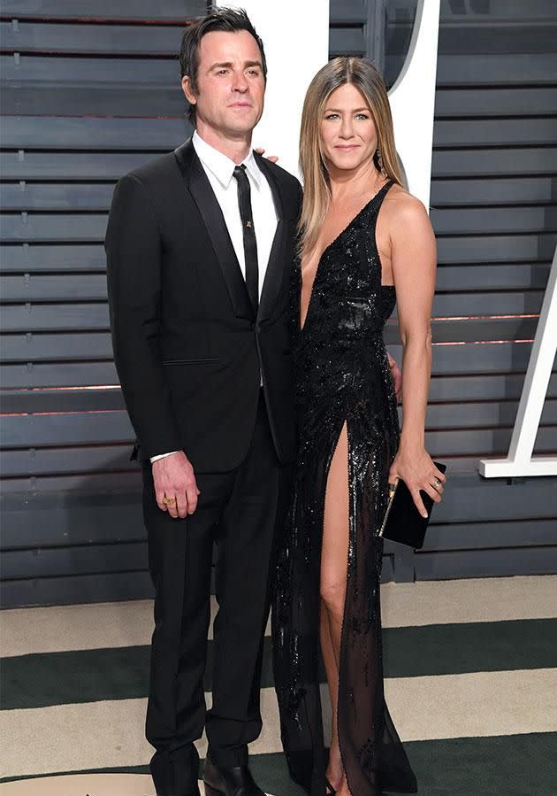 Jen glowed in an intricately beaded black Versace gown accompanied by hubby Justin at the <i>Vanity Fair</i> after party. Photo: Getty Images