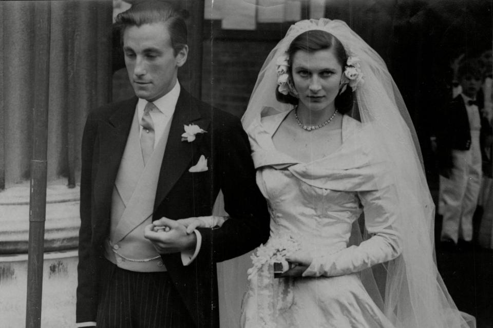 With his first wife Lady Caroline Thynne on their wedding day in 1950 (Rex)