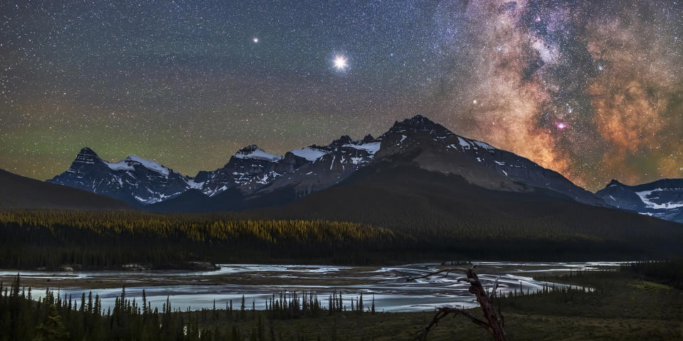 Jupiter (brightest), Saturn (to the left), and the Milky Way over the Saskatchewan River and the area of Howse Pass, on July 26, 2020. Mount Cephren is at left; the scene is framed to include Cephren. The nebulas and star clouds of the galactic centre are (Alan Dyer / VW PICS / Universal Images Group via Getty Images)