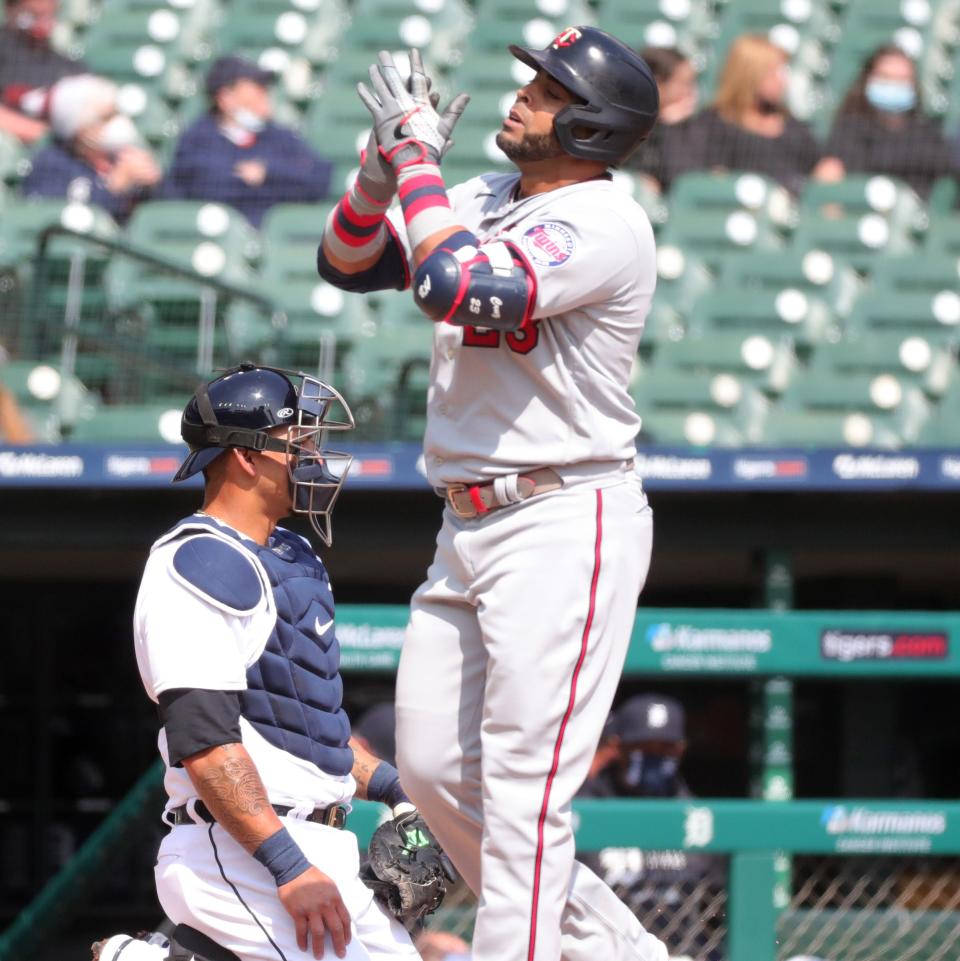 Minnesota Twins designated hitter Nelson Cruz (23) after his grand slam against Detroit Tigers starting pitcher Jose Urena (62) during second inning action Monday, April 5, 2021, at Comerica Park in Detroit.