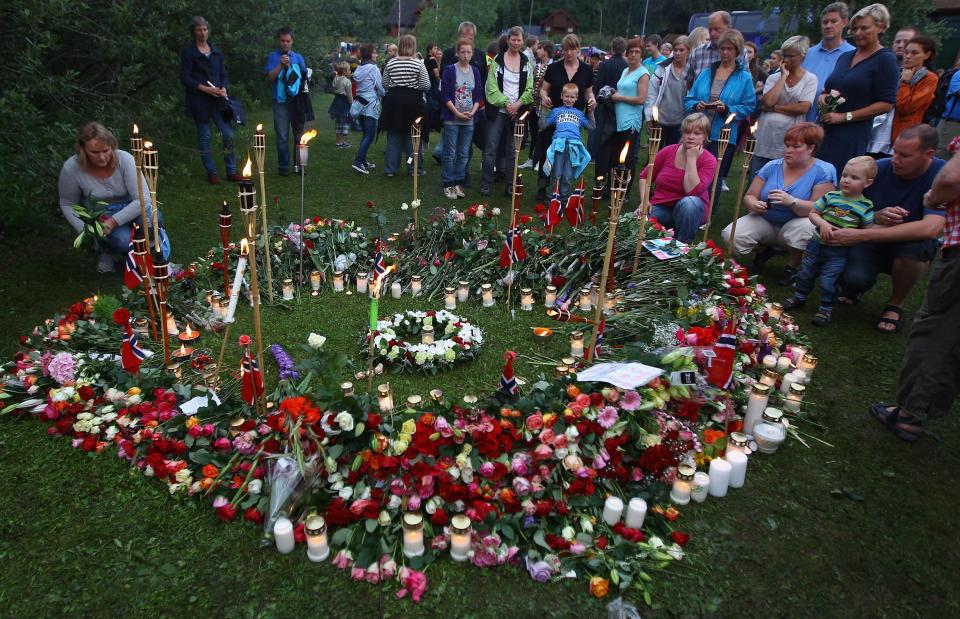 A vigil on July 26, 2011, near the Norwegian island of Utoya, where a gunman killed 69 after he exploded a car bomb at the government quarter in Oslo, killing eight people.