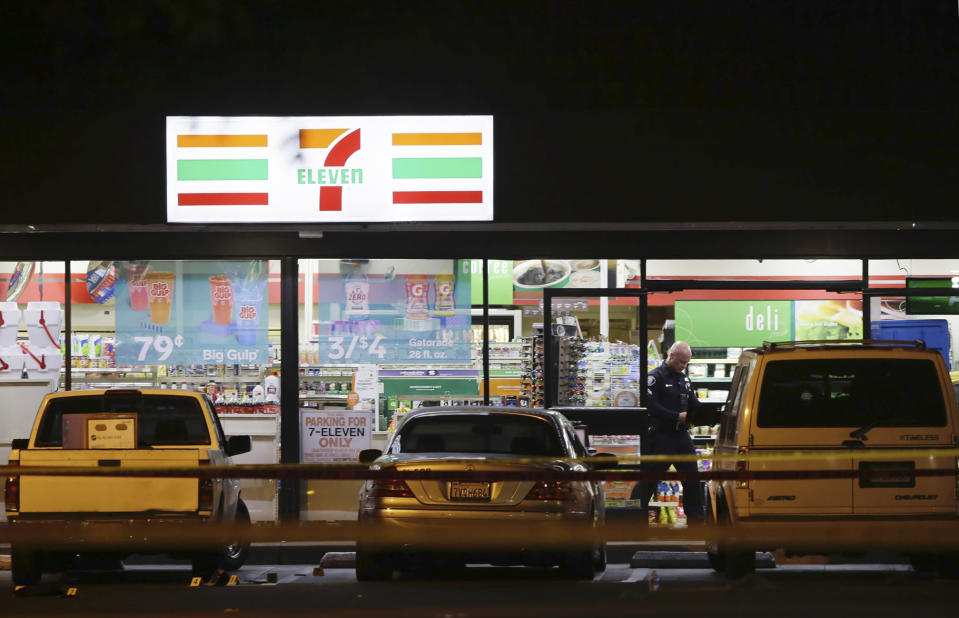 Police work the scene of a stabbing in Santa Ana, Calif., Wednesday, Aug. 7, 2019. A man killed multiple people and wounded others in a string of robberies and stabbings in California's Orange County before he was arrested, police said Wednesday. (AP Photo/Alex Gallardo)