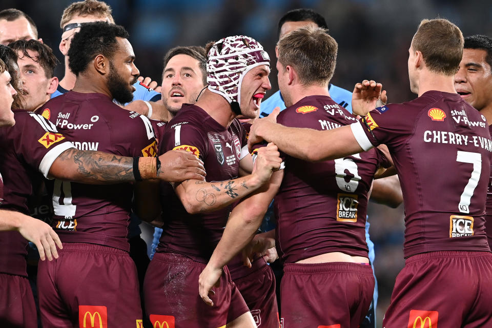 Pictured here, Kalyn Ponga celebrates with Maroons teammates in State of Origin Game III.