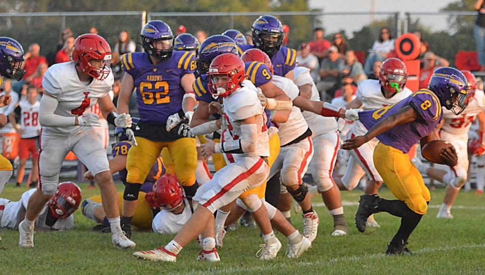 A one-hand grasp on the jersey isn't nearly enough to stop Watertown's Juven Hudson from breaking free on a touchdown run during an Eastern South Dakota Conference football game against Yankton on Friday, Sept. 8, 2023 at Watertown Stadium.