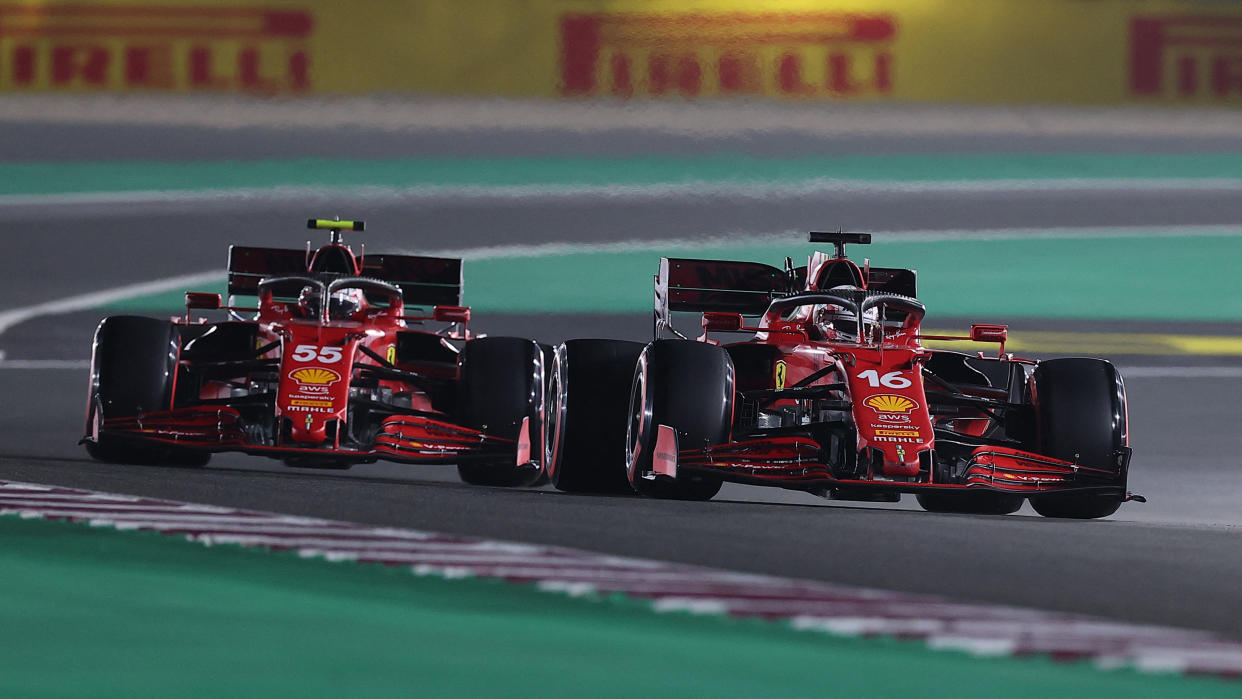 Ferrari's Monegasque driver Charles Leclerc (R) and Ferrari's Spanish driver Carlos Sainz Jr (L) drive during the qualifying session ahead of the Qatari Formula One Grand Prix at the Losail International Circuit, on the outskirts of the capital city of Doha, on November 20, 2021. (Photo by KARIM JAAFAR / AFP) (Photo by KARIM JAAFAR/AFP via Getty Images)