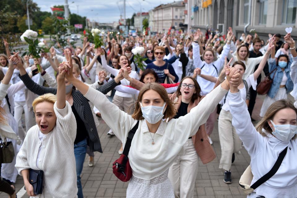 Women dressed in white protest against police violence in Minsk on August 12, 2020. / Credit: SERGEI GAPON