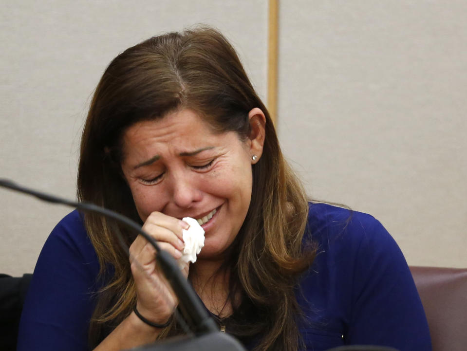 Ingrid Llerena, Roy Oliver's wife, cries while testifying about defendant Oliver, who was convicted for the murder of 15-year-old Jordan Edwards, during the sentencing phase at the Frank Crowley Courts Building in Dallas on Wednesday, Aug. 29, 2018. Oliver's wife also testified, saying in Spanish that she was concerned about their 3-year-old son, who is autistic, and the boy's future without his father at home. (Rose Baca/The Dallas Morning News via AP, Pool)