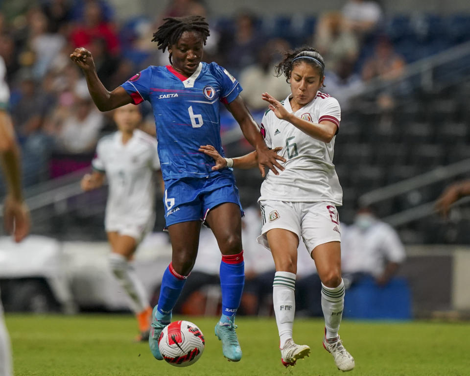 FILE - Haiti's Melchie Dumornay, left, and Mexico's Aleixa Delgado vie for the ball during a CONCACAF Women's Championship soccer match in Monterrey, Mexico, Thursday, July 7, 2022. (AP Photo/Fernando Llano, File)