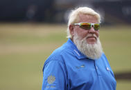 John Daly of the United States stands on the 17th green during a 'Champions round' as preparations continue for the British Open golf championship on the Old Course at St. Andrews, Scotland, Monday July 11, 2022. The Open Championship returns to the home of golf on July 14-17, 2022, to celebrate the 150th edition of the sport's oldest championship, which dates to 1860 and was first played at St. Andrews in 1873. (AP Photo/Peter Morrison)