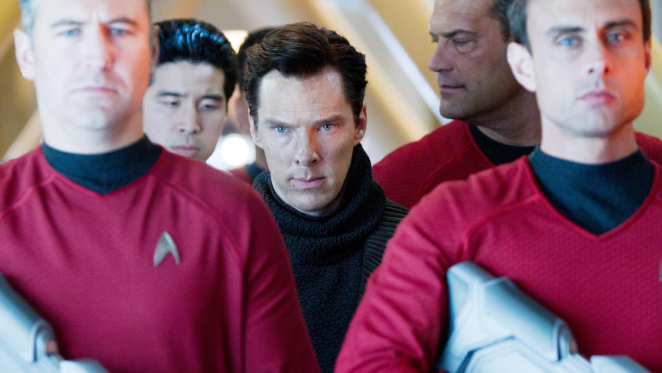 Benedict Cumberbatch surrounded by Starfleet officers in uniforms