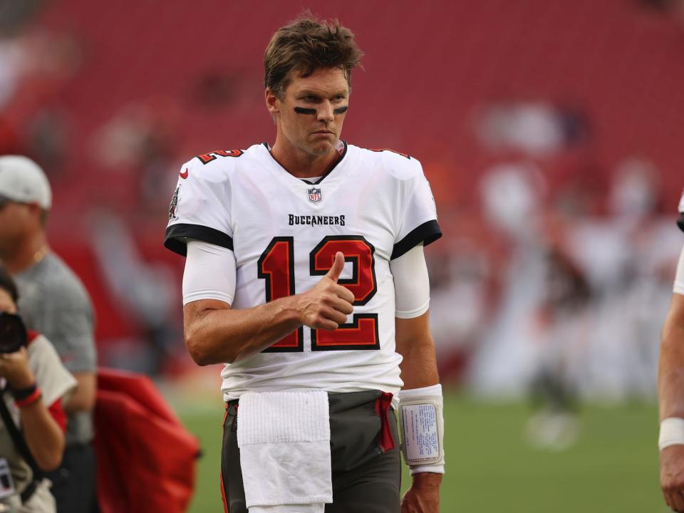 Tom Brady gives a thumbs-up during a preseason game in 2021.