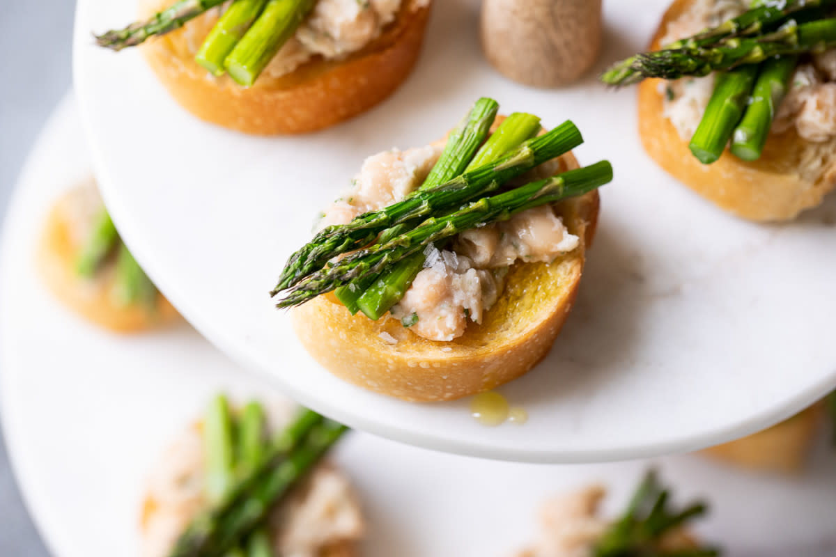 <p>Luci's Morsels</p><p>This delicious cold asparagus appetizer is a winning recipe to keep on hand year round. The white bean spread, fresh baguette slices, and fresh rosemary merry beautifully in this asparagus crostini for the perfect flavor combination!</p><p><strong>Get the recipe: <a href="https://www.lucismorsels.com/cold-asparagus-appetizer-crostini/" rel="nofollow noopener" target="_blank" data-ylk="slk:Asparagus Crostini Appetizer;elm:context_link;itc:0;sec:content-canvas" class="link rapid-noclick-resp">Asparagus Crostini Appetizer</a></strong></p>