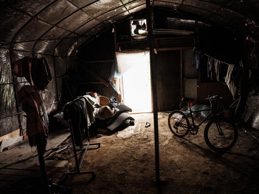 Inside makeshift housing on farms, where living conditions are often squalid and spartan.