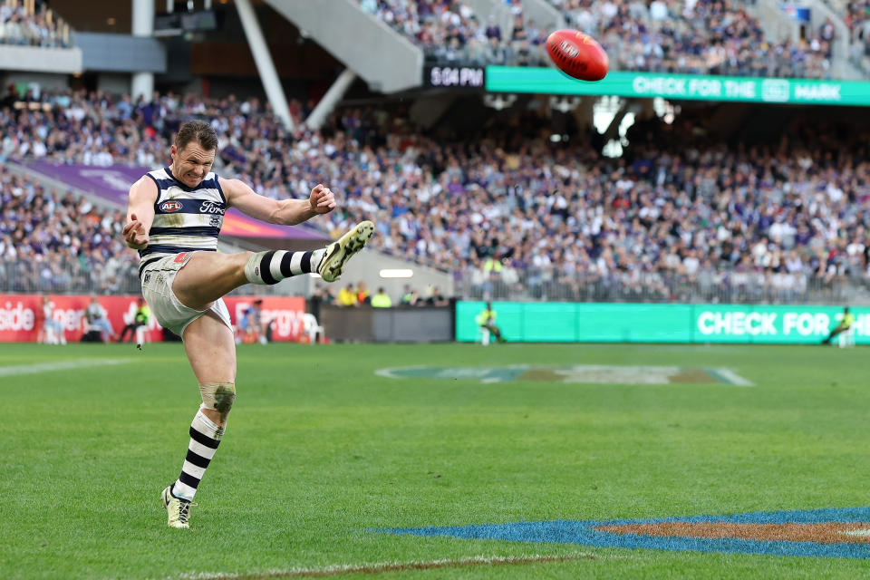 PERTH, AUSTRALIA - AUG 10: Patrick Dangerfield of the Cats kicks on goal during the 2024 AFL Round 22 match between the Fremantle Dockers and the Geelong Cats at Optus Stadium on August 10, 2024 in Perth, Australia. (Photo by Will Russell/AFL Photos via Getty Images)