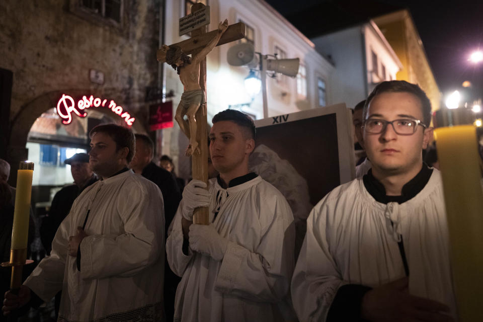 Men wearing altar-boy robes take part in a pro-life march in Zagreb, Croatia, Friday, March 15, 2024. Scores of religious and neo-conservative groups in recent years have been building up pressure in the staunchly Catholic country, trying to force a ban on abortions. (AP Photo/Darko Bandic)