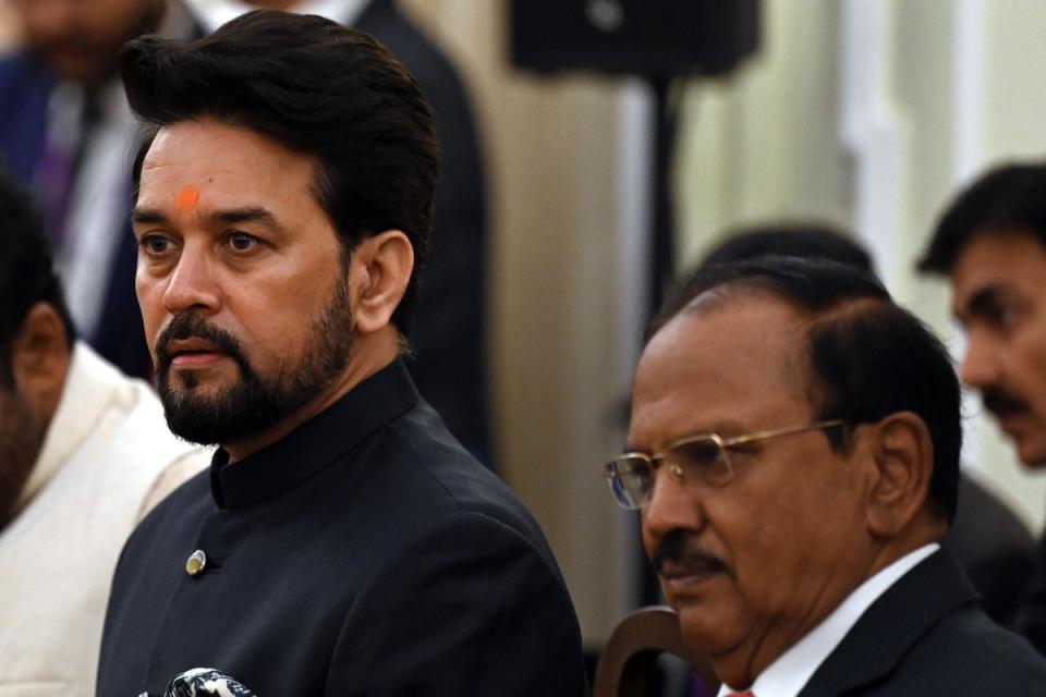India’s minister of information and broadcasting Anurag Thakur (L) and national security advisor Ajit Doval at the Hyderabad House in New Delhi  (AFP via Getty Images)