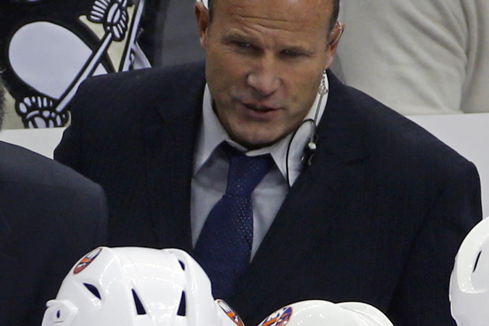 FILE - New York Islanders assistant coach Greg Cronin is shown during the third period of an NHL hockey game against the Pittsburgh Penguins, Saturday, Oct. 18, 2014. The Anaheim Ducks have hired veteran NHL assistant and AHL head coach Greg Cronin to be their new head coach. Ducks general manager Pat Verbeek announced the decision Monday to hire the 60-year-old Cronin, who will be a first-time NHL head coach. (AP Photo/Gene J. Puskar, File)