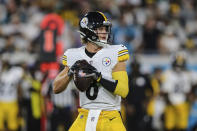 FILE - Pittsburgh Steelers quarterback Kenny Pickett (8) looks for a receiver during the first half of an NFL preseason football game against the Jacksonville Jaguars, Saturday, Aug. 20, 2022, in Jacksonville, Fla. Pickett is battling with fellow Steelers quarterback Mitch Trubisky for the right to replace longtime starting quarterback Ben Roethlisberger, who retired in January. (AP Photo/Gary McCullough, File)