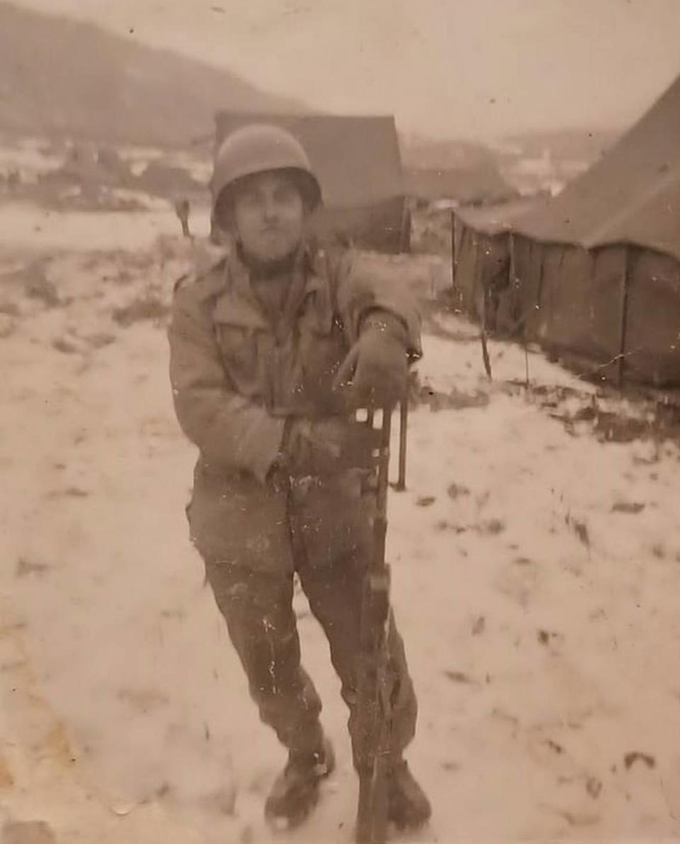 Paul Vasquez poses in Korea with his Browning Automatic Rifle.
