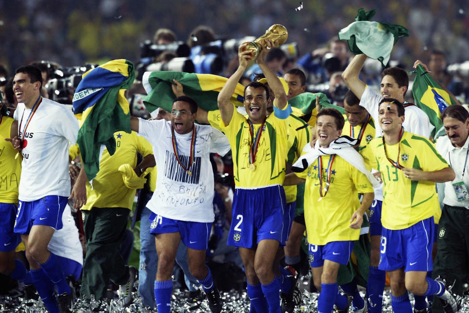 YOKOHAMA - JUNE 30:  Brazil celebrate as Cafu lfts the trophy after the Germany v Brazil, World Cup Final match played at the International Stadium Yokohama in Yokohama, Japan on June 30, 2002. Brazil won 2-0. (Photo by Alex Livesey/Getty Images)