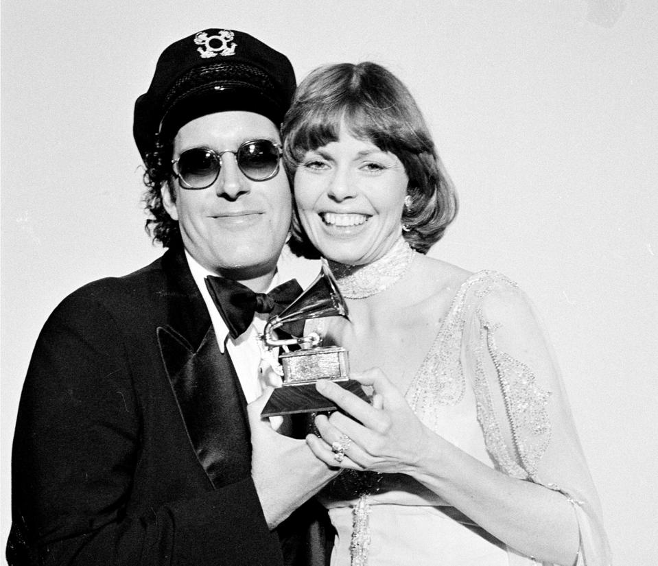 FILE - In this Feb. 28, 1976 file photo, Daryl Dragon and his wife Toni Tennille, of the Captain & Tennille, hold the Grammy award they won for record of the year for "Love Will Keep Us Together," at the Grammy Awards ceremony in Los Angeles. Dragon died early Wednesday, Jan. 2, 2019 in at a hospice in Prescott, Ariz. Spokesman Harlan Boll said he was 76 and died of renal failure. His former wife and musical partner, Toni Tennille, was by his side. (AP Photo, FIle)