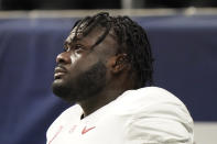 Alabama offensive lineman Alex Leatherwood (70) warms up before the first half of the Southeastern Conference championship NCAA college football game between Florida and Alabama, Saturday, Dec. 19, 2020, in Atlanta. Leatherwood was selected to The Associated Press All-America first-team offense, Monday, Dec. 28, 2020. (AP Photo/Brynn Anderson)