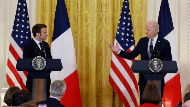 PHOTO: President Joe Biden speaks as French President Emmanuel Macron listens during a joint press conference in the East Room of the White House, Dec. 1, 2022.  (Ludovic Marin/AFP via Getty Images)