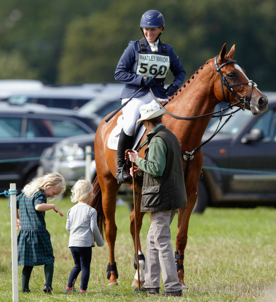 STROUD, UNITED KINGDOM - SEPTEMBER 11: (EMBARGOED FOR PUBLICATION IN UK NEWSPAPERS UNTIL 48 HOURS AFTER CREATE DATE AND TIME) Princess Anne, The Princess Royal and her grandchildren Isla Phillips and Savannah Phillips talk with Zara Phillips after she competed in the show jumping phase of the Whatley Manor International Horse Trials at Gatcombe Park on September 11, 2015 in Stroud, England. (Photo by Max Mumby/Indigo/Getty Images)