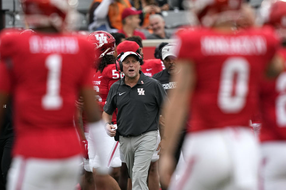 Houston coach Dana Holgorsen yells to his players during the first half of an NCAA college football game against Oklahoma State Saturday, Nov. 18, 2023, in Houston. (AP Photo/David J. Phillip)