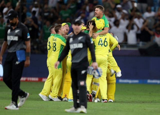 Australia celebrate winning the T20 World Cup after defeating New Zealand by eight wickets in the final at the Dubai International Cricket Stadium