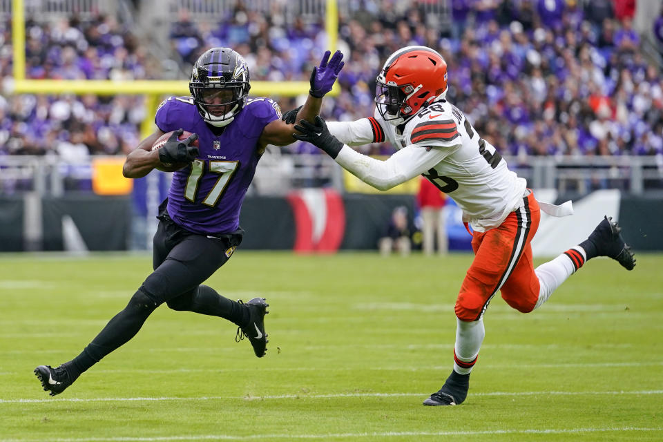 Baltimore Ravens running back Kenyan Drake (17) is stopped by Cleveland Browns linebacker Jeremiah Owusu-Koramoah (28) after a catch in the second half of an NFL football game, Sunday, Oct. 23, 2022, in Baltimore. (AP Photo/Julio Cortez)