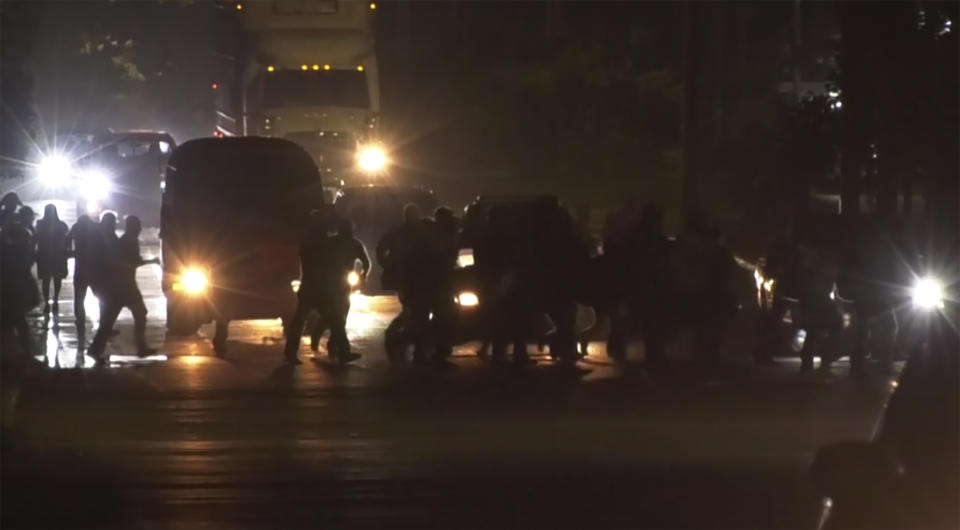 In this image from a video, a migrants caravan leave San Pedro Sula, Honduras early Saturday, Jan. 20, 2024. A caravan of some 500 migrants that departed northern Honduras in hopes of reaching the United States dissolved Sunday after crossing the border into Guatemala, the Guatemalan Migration Institute reported. (AP Photo)