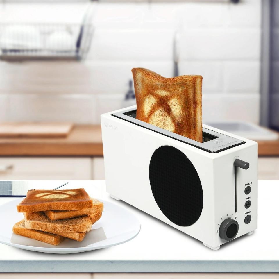 An Xbox S Series Toaster with toast marked with an X in both the machine and on a plate nearby