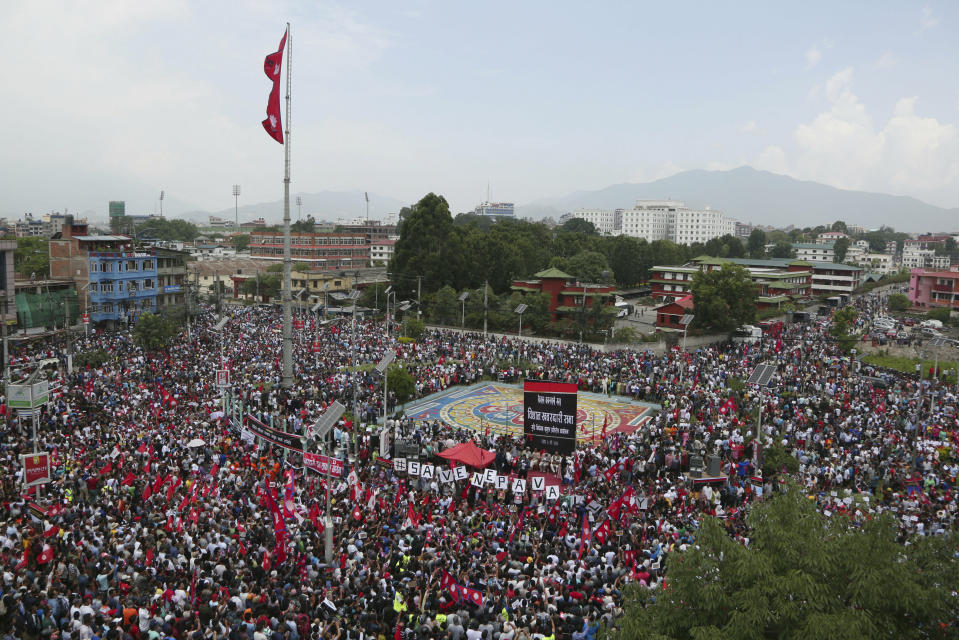 Nepalese Newar community people gather during a protest against government in Kathmandu, Nepal, Wednesday, June 19, 2019. Thousands of people protested in the Nepalese capital to protest a Bill that would give government control over community and religious trusts. Protesters demanded the government scrap the proposed Bill to protect these trusts that hold religious ceremonies and festivals. (AP Photo/Niranjan Shrestha)