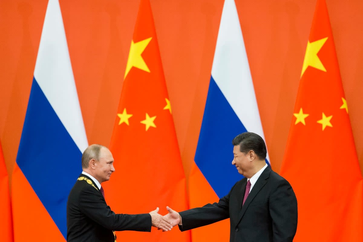 Pleased to meet you: Russian president Vladimir Putin and Chinese president Xi Jinping in Beijing in 2018 (AP)