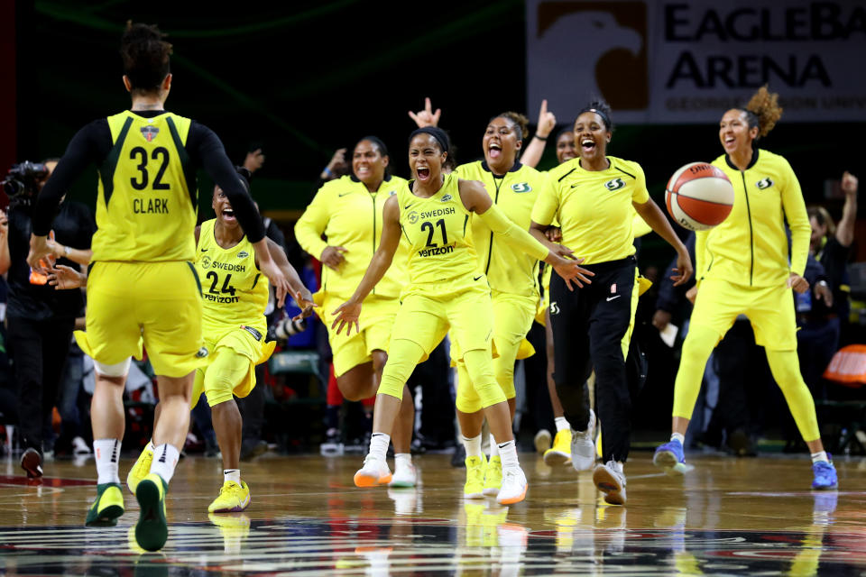 Members of the Seattle Storm celebrate after defeating the Washington Mystics 98-82 to win the WNBA Finals at EagleBank Arena on September 12, 2018, in Fairfax, Virginia. (Photo by Rob Carr/Getty Images)