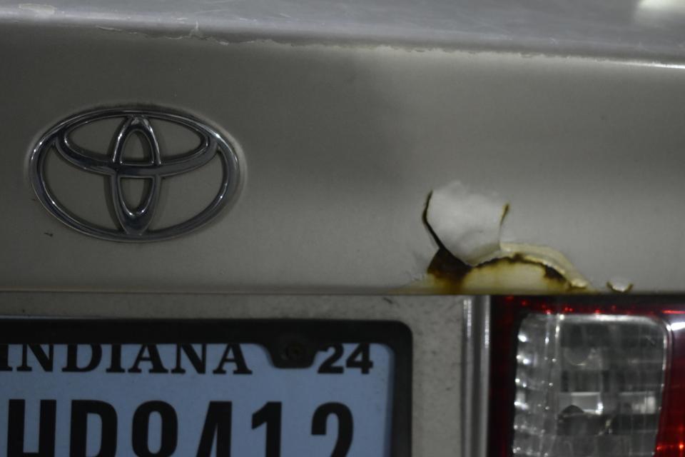 Distinctions such a this peeling paint on the edge of the trunk lid lend character to old cars like my 2001 Camry and make them easy to locate in a parking lot.