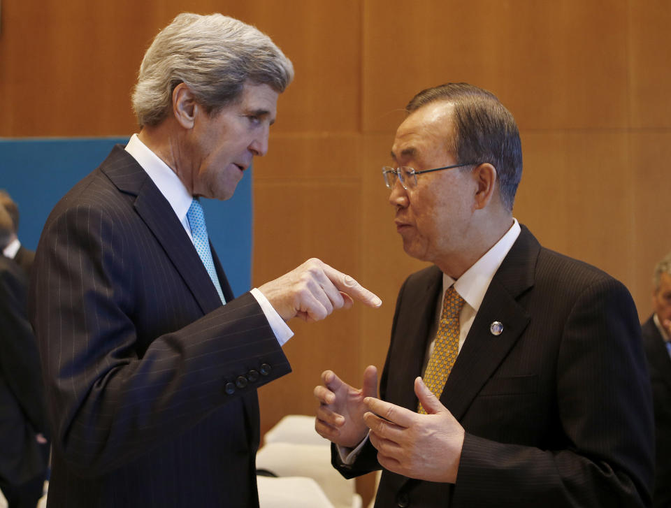 U.S. Secretary of State John Kerry, left, talks to U.N. Secretary-General Ban Ki-moon prior to the Syrian peace talks in Montreux, Switzerland, Wednesday, Jan. 22, 2014. Ban made a rare effort at solo diplomacy this week when he invited Iran to join this week’s Syria peace talks, but it backfired, raising questions about the effectiveness of a U.N. secretary-general better known _ and often criticized _ for his reserved and scripted style. (AP Photo/Arnd Wiegmann, Pool)