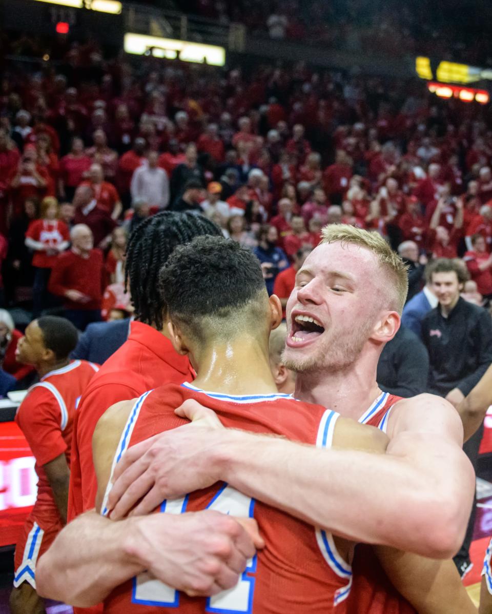 Bradley's Rienk Mast, facing, celebrates with teammate Malevy Leons and a packed house after defeating Drake 73-61 for the MVC championship Sunday, Feb. 26, 2023 at Carver Arena.