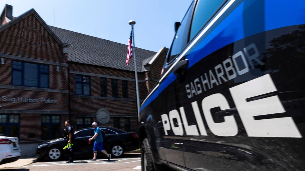 A Sag Harbor police officer arrives to the headquarter on the day Timberlake was arrested. REUTERS