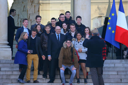 French Agriculture Minister Stephane Travert (C) poses with young French farmers after a meeting at the Elysee Palace in Paris, France, February 22, 2018. REUTERS/Stephane Mahe