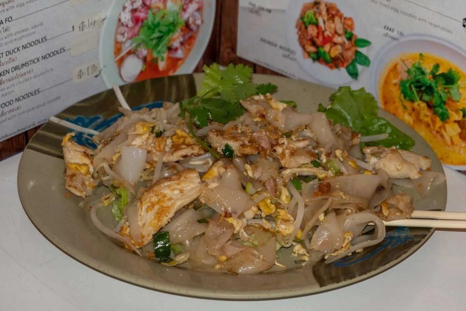 Gooay teow cuo gai (chicken noodles) is a popular street food dish in Bangkok