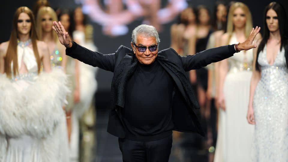 Roberto Cavalli walks the runway after a fashion show showcasing his label's designs in Budva, Montenegro on June 10, 2013. - Savo Prelevic/AFP/Getty Images