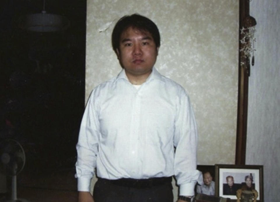 This Nov. 2006 photo provided by Kazuo Sawato shows Sawato, a mental counselor, at his parents’ home in Chiba, east of Tokyo, a year after jumping from an apartment building in a failed suicide attempt, and suffering from a recurring depression after developing a colon problem. The 31-year-old Japanese office worker ran to the roof's edge and jumped. He landed on his legs, and initially regretted surviving. Now 42, Sawato says he is glad to be alive and wants to share his journey back to the world of the living with others who struggle under the societal pressure that make Japan one of the world's most suicide-prone societies. (Kazuo Sawato via AP)