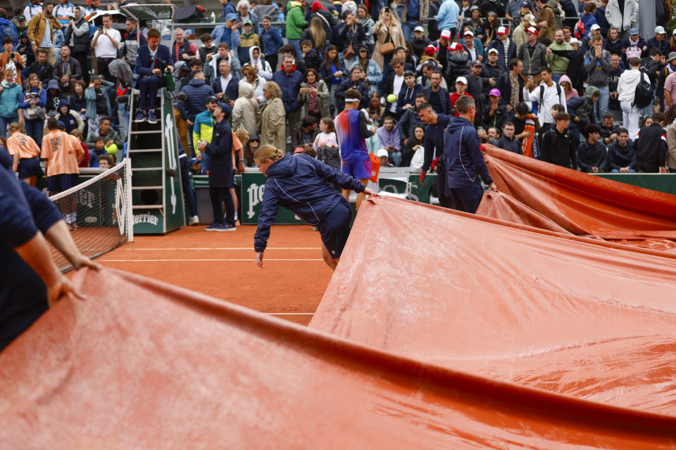 Rain interrupted the second round match of the French Open tennis tournament between Japan's Kei Nishikori and Ben Shelton of the U.S. at the Roland Garros stadium in Paris, Wednesday, May 29, 2024. (AP Photo/Jean-Francois Badias)