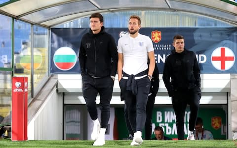 Harry Kane and Harry Maguire of England lead their side out to inspect the pitch - Credit: Catherine Ivill/Getty Images