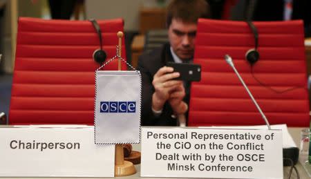 Diplomats wait for the start of a meeting of the permanent council of the OSCE, the Organization for Security and Cooperation in Europe, on Nagorno-Karabakh in Vienna, Austria, April 5, 2016. REUTERS/Leonhard Foeger