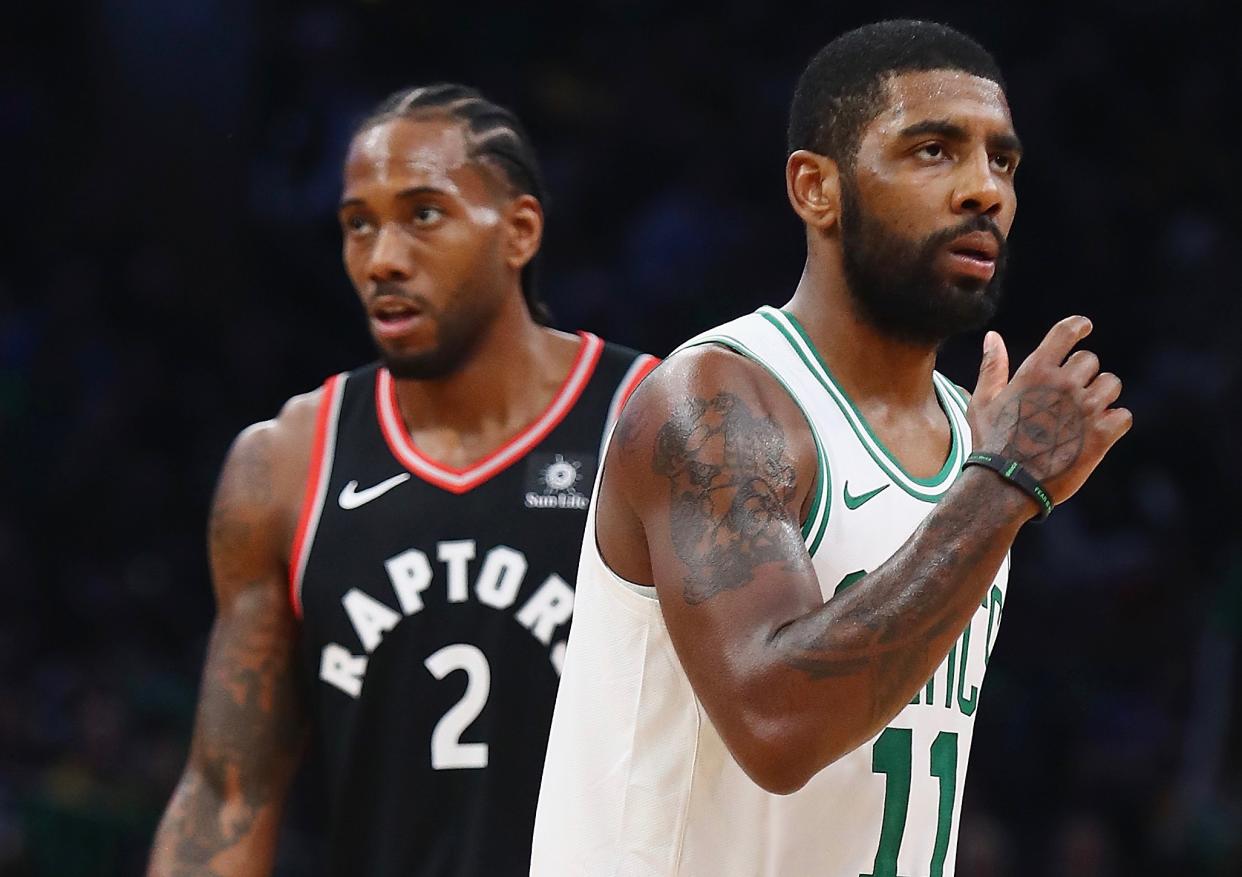 Kawhi Leonard reportedly recruited Kyrie Irving in free agency. (Getty)