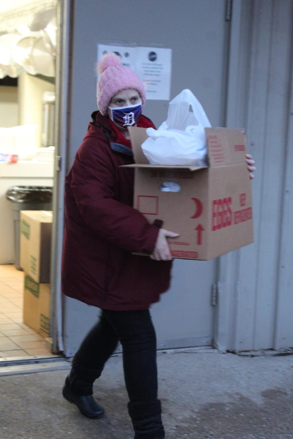 Each vehicle would tell a volunteer how many dinners they needed to feed those in their families and the volunteers would package those meals into a box or bags, then deliver them to the vehicle.