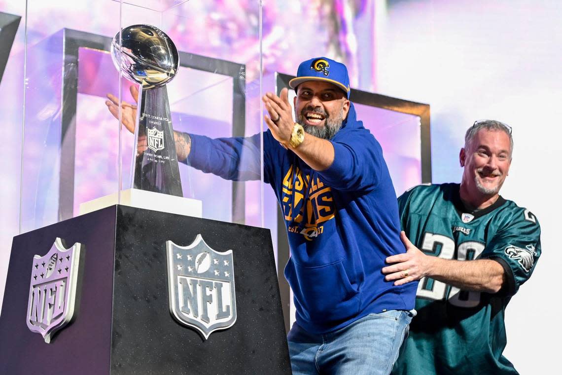 Football fans clowned around as they viewed the Vince Lombardi Trophy as they took in the NFL Super Bowl Experience on Friday, Feb. 10, 2023, at the Phoenix Convention Center.